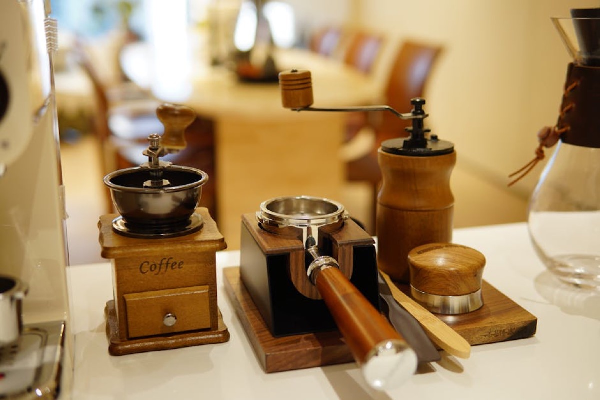 Coffee grinders and espresso accessories displayed in cafe