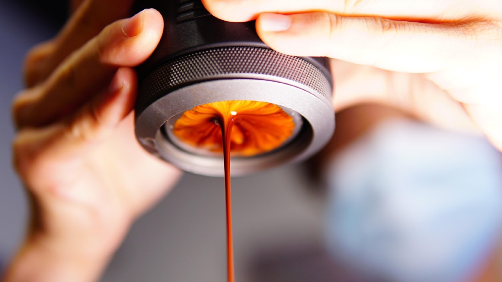 Barista pulling espresso shot with portafilter