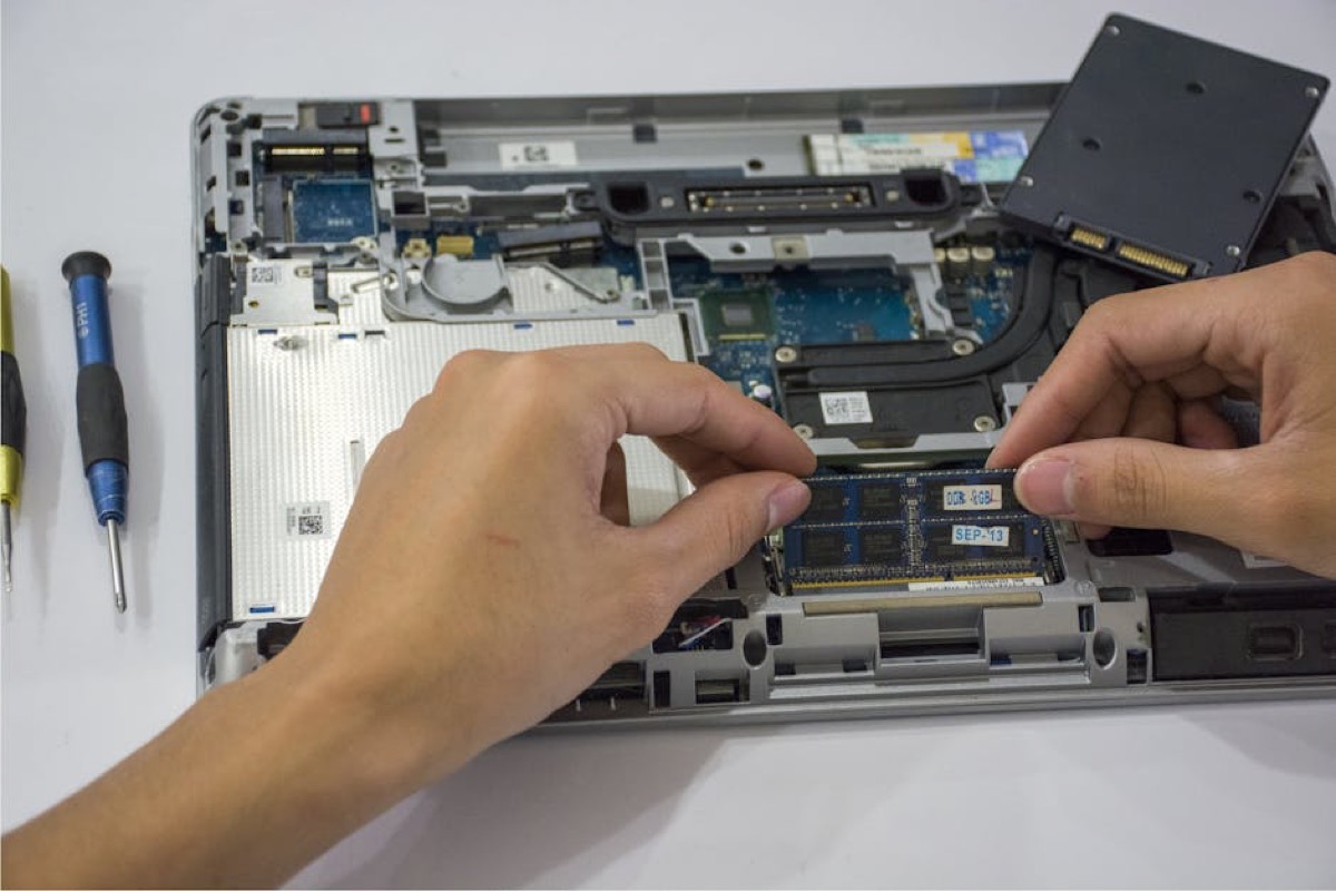 Close-up of hands performing precision installation work